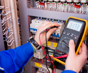 Electrician testing electrical panel